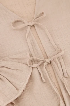 Beige Shiny Top Met Strikjes & Ruffle Mouwtjes