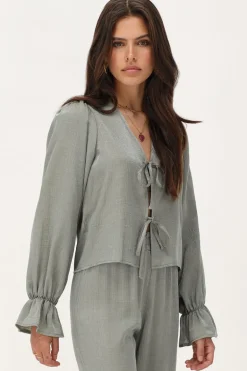 Groene Shiny Top Met Strikjes & Ruffle Mouwtjes