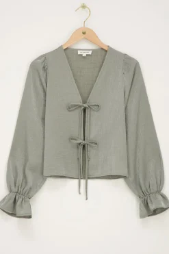 Groene Shiny Top Met Strikjes & Ruffle Mouwtjes